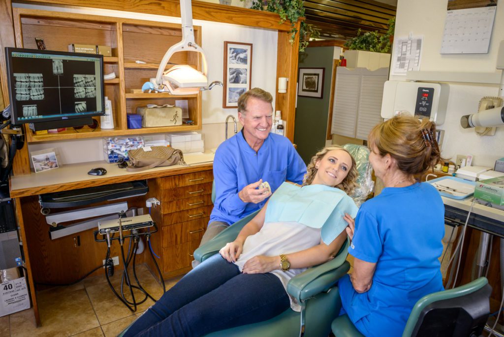 Dentist and patient during dental appointment